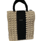 Handcrafted tote bag in beige and black, featuring stylish crochet design and durable straps