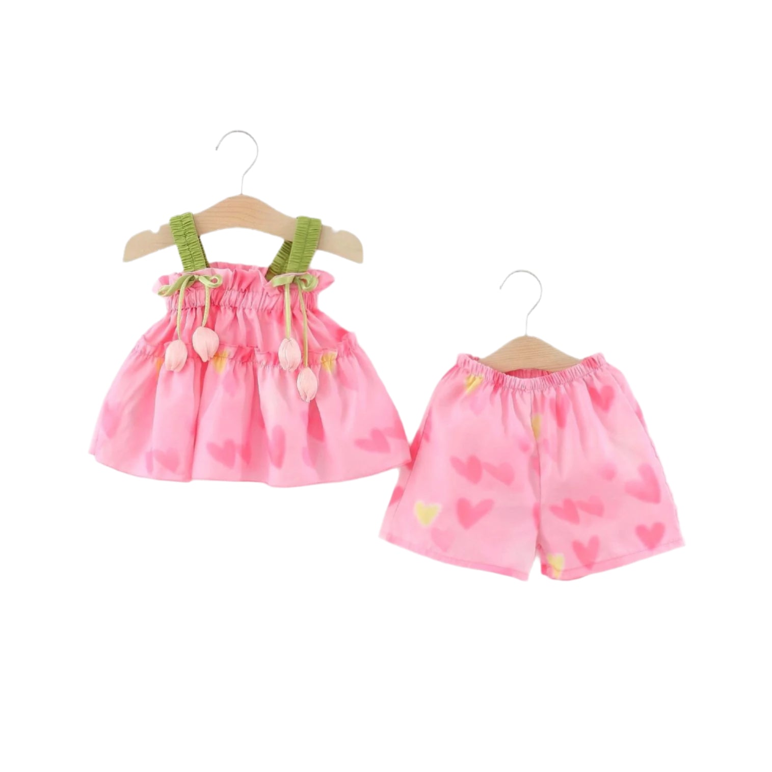 Pink tulip top and shorts outfit for kids with green straps and heart patterns