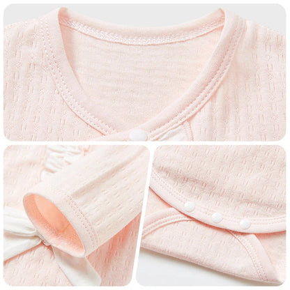 Close-up of LuckeLadybug LLC unisex baby cotton rompers showing soft fabric and button details