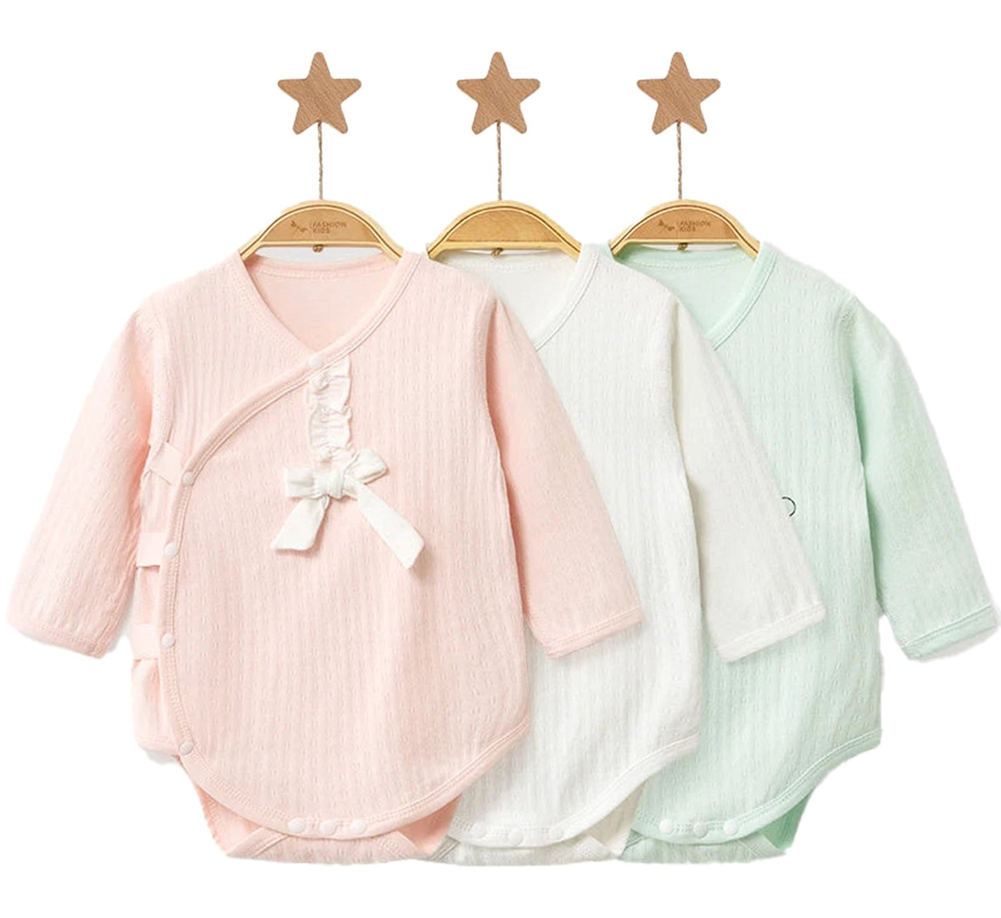 Set of three unisex baby cotton rompers in pink, white, and mint with snap closures and bow details