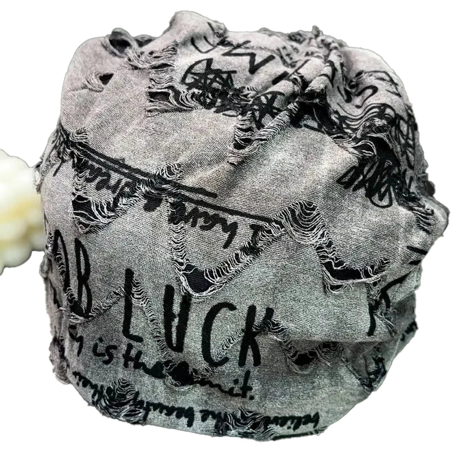 Stylish unisex hip hop beanie hat with a distressed design and trendy graffiti print