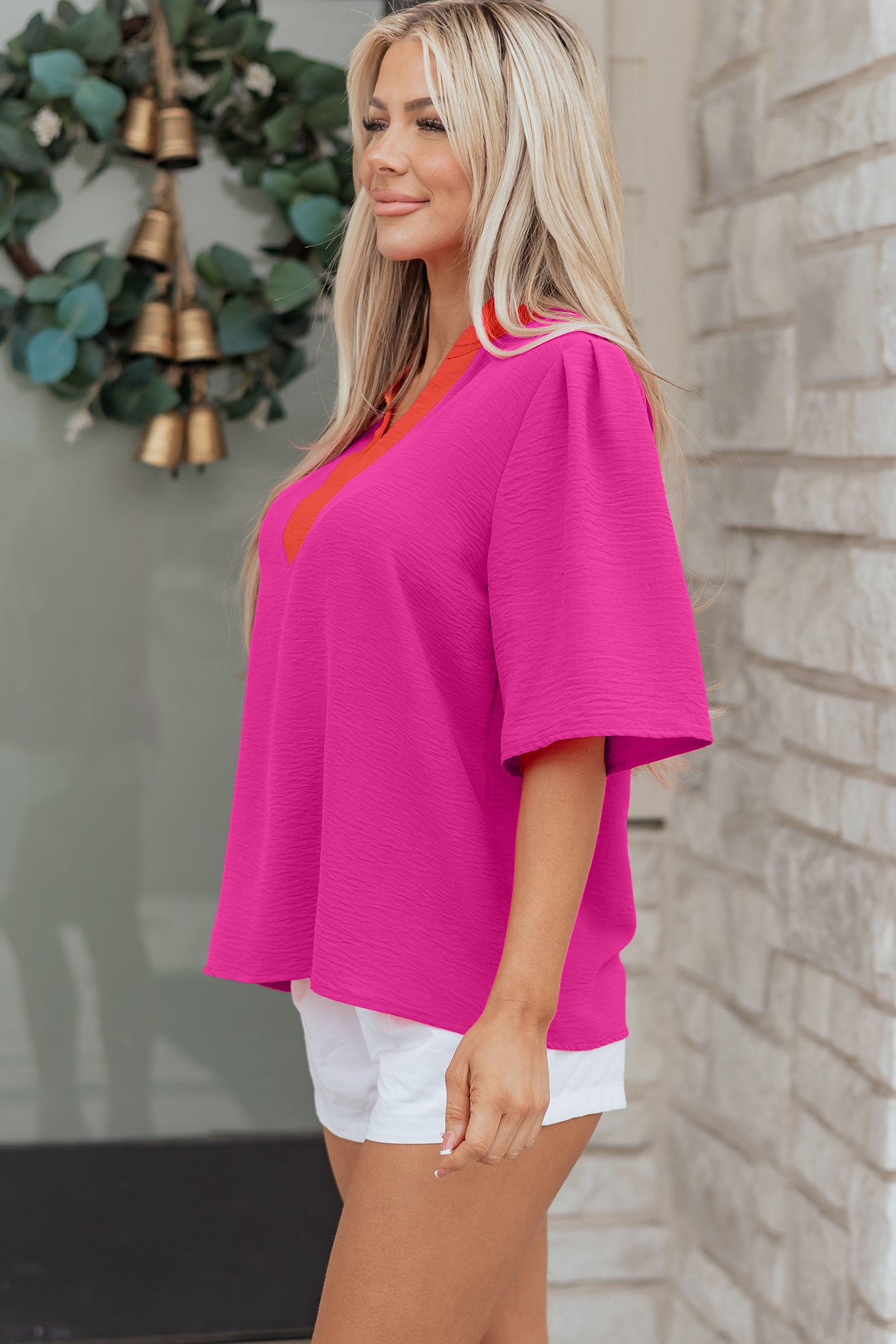LuckeLadybug LLC vibrant pink v neck top with short sleeves for a stylish summer look