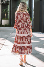 Back view of a LuckeLadybug LLC fit & flare maxi dress with paisley print and flared sleeves