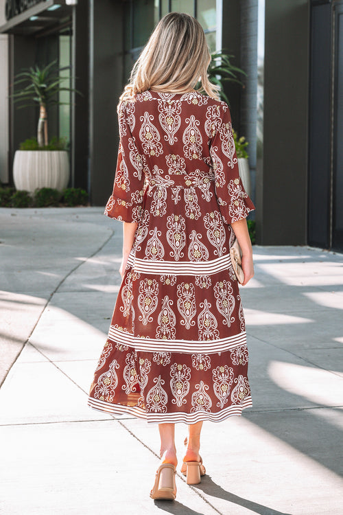 Back view of a LuckeLadybug LLC fit & flare maxi dress with paisley print and flared sleeves