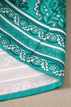 Close-up of LuckeLadybug LLC teal fit & flare design with intricate patterns for a stylish and maxi dress.