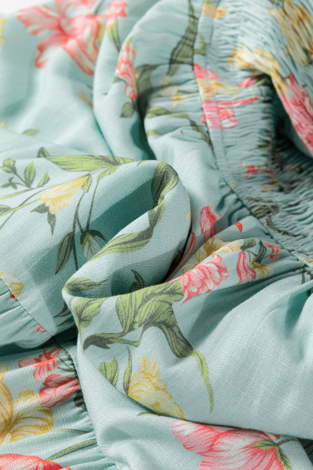 Close-up of floral fabric detail from LuckeLadybug LLC fit & flare and maxi dress
