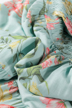 Close-up of floral fabric detail from LuckeLadybug LLC fit & flare and maxi dress