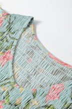 Close-up of floral design on a LuckeLadybug LLC fit and flare maxi dress with textured fabric