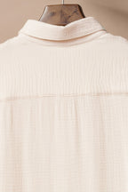 Beige cover-up by LuckeLadybug LLC, perfect for layering over a swimsuit and maxi dress.