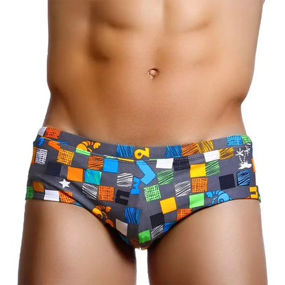 Colorful Brazilian men's swimwear featuring a geometric print for stylish beachwear