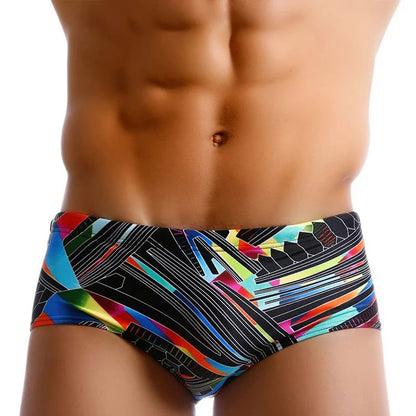 Colorful LuckeLadybug LLC Brazilian men's swimwear showcasing a modern abstract design for stylish beachwear