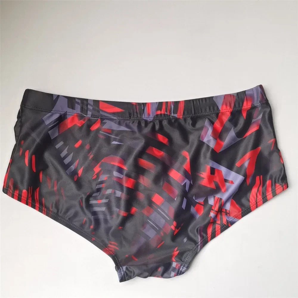 LuckeLadybug Brazilian men's swimwear featuring a stylish red and black geometric pattern