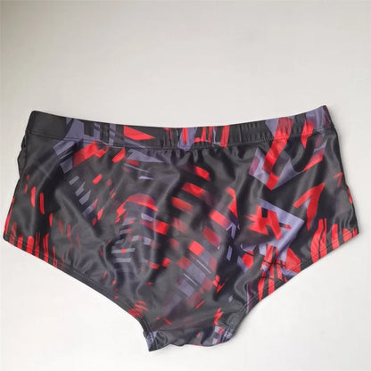 LuckeLadybug Brazilian men's swimwear featuring a stylish red and black geometric pattern