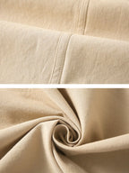 Close-up of beige fabric showing texture and stitching for a button up shirt for men