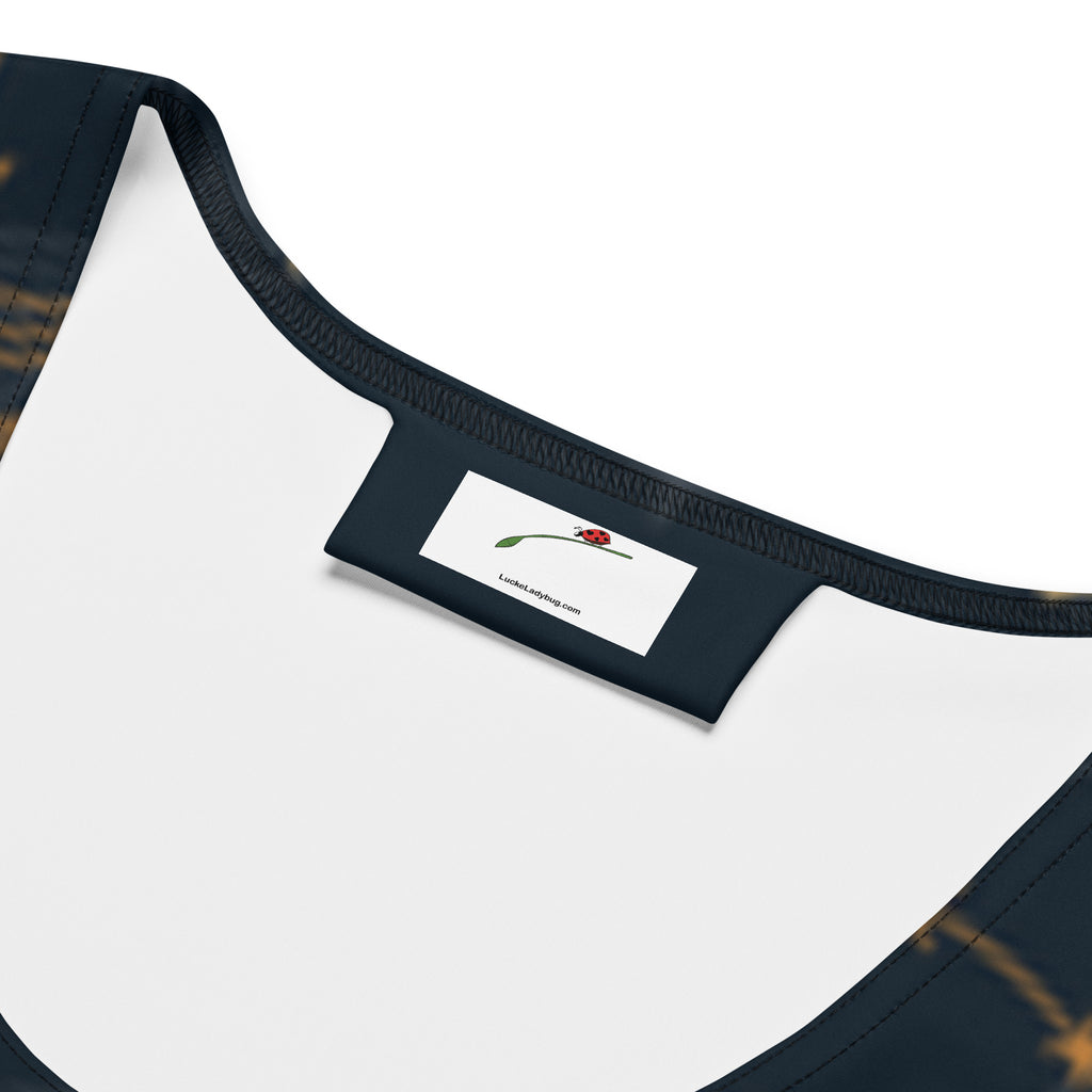 Close-up of LuckeLadybug celestial bodycon dress neckline and label detailing