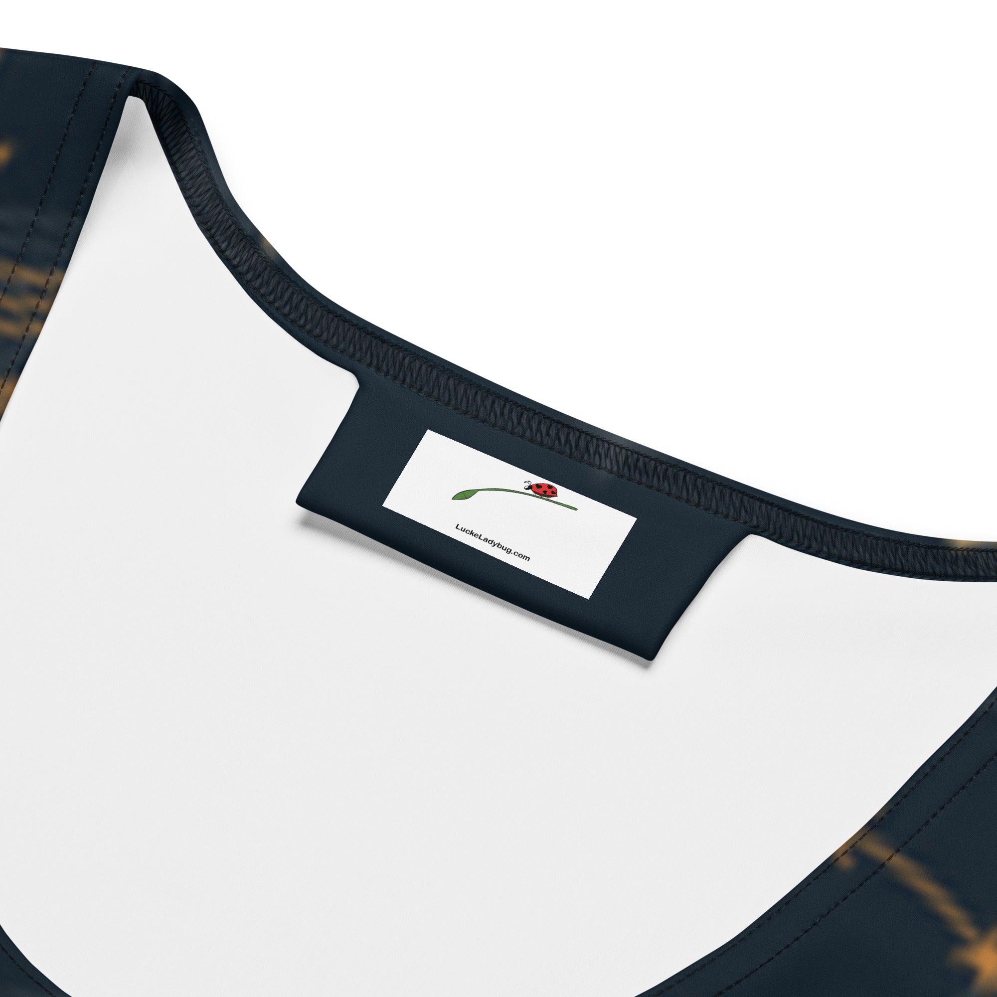 Close-up of LuckeLadybug celestial bodycon dress neckline and label detailing