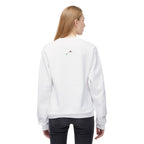 LuckeLadybug coffee lover fleece sweatshirt in white with small rose detail on the back, worn by a woman