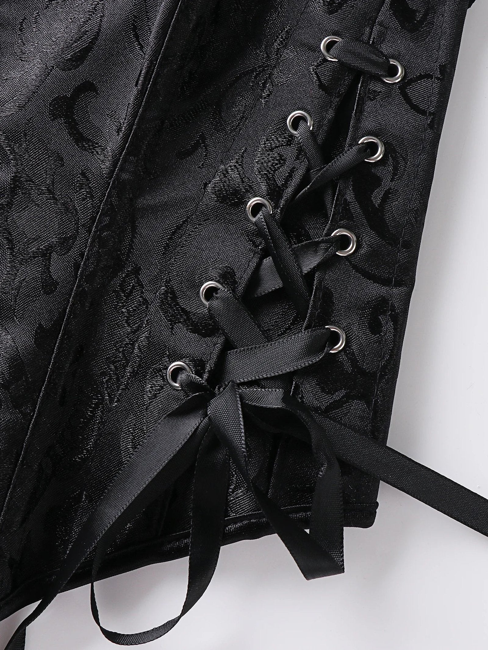 Close-up of black lace trim double halter corset featuring intricate lace-up detailing