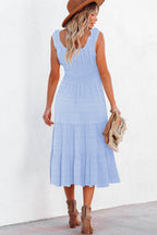 Light blue midi dress with ruffled straps and tiered skirt, perfect for summer occasions