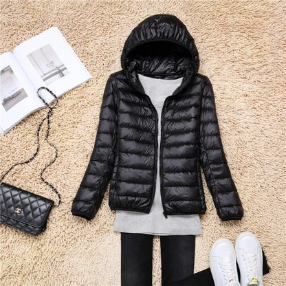 Black plus size women puffer jacket with hood, perfect for winter fashion and warmth
