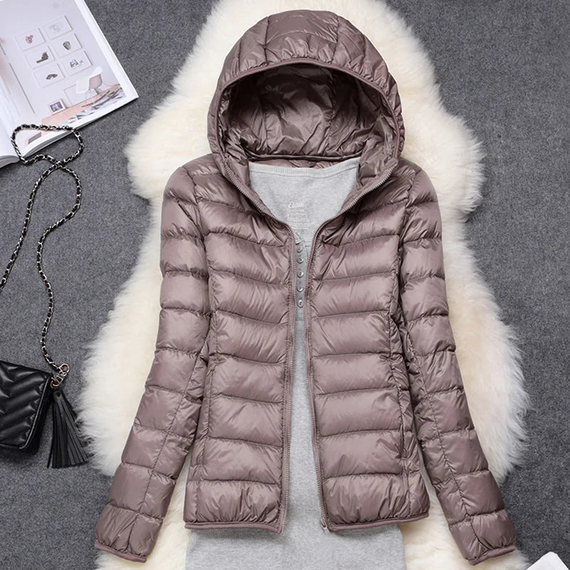 Plus size women puffer jacket in light brown with hood and soft fabric for warmth and style