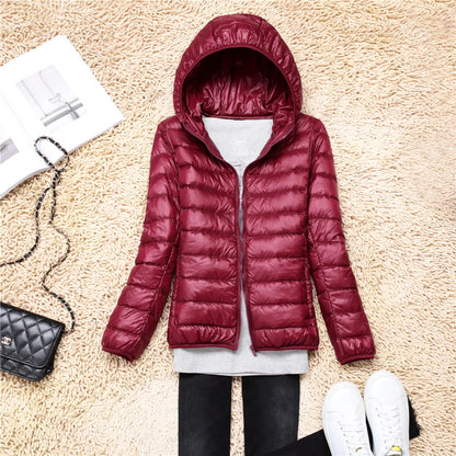 Burgundy plus size women puffer jacket with a cozy hood for stylish winter warmth