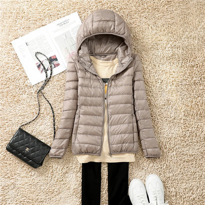 Lightweight beige plus size women puffer jacket with hood, perfect for casual winter outings