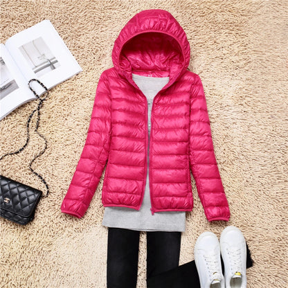 Bright pink plus size women puffer jacket with hood, ideal for winter fashion and warmth