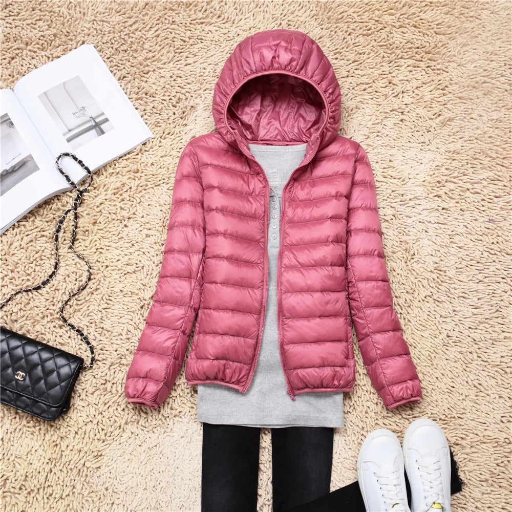 Pink plus size women puffer jacket with hood, perfect for stylish winter wear