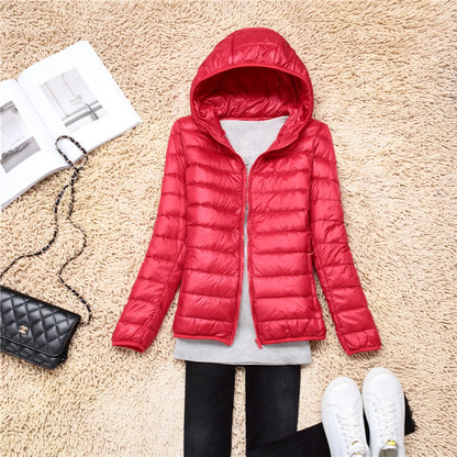 Bright red plus size women puffer jacket with hood, ideal for stylish winter wear