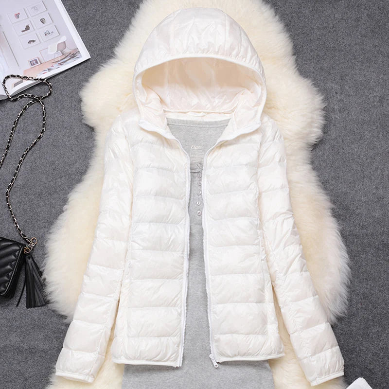 White plus size women puffer jacket with a hood, perfect for warmth during cold weather