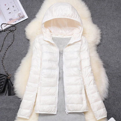 White plus size women puffer jacket with a hood, perfect for warmth during cold weather
