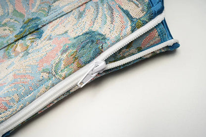 Close-up of a floral patterned zipper detailing on a Victorian corset top for women