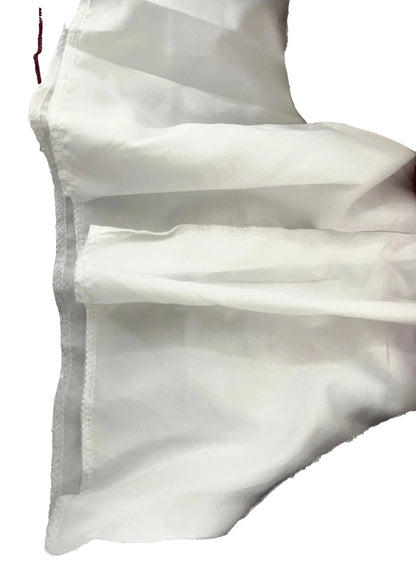 Close-up of white fabric swing dress showcasing detailed stitching features of the vintage patchwork mini sundress