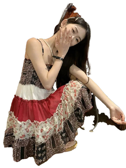 Model wearing a vintage patchwork mini sundress with floral patterns and ruffled hem for summer outings