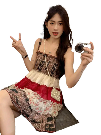Stylish woman in a vintage patchwork mini sundress posing for a photo with a camera