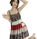 Model wearing a vintage patchwork mini sundress featuring colorful layers and a stylish design