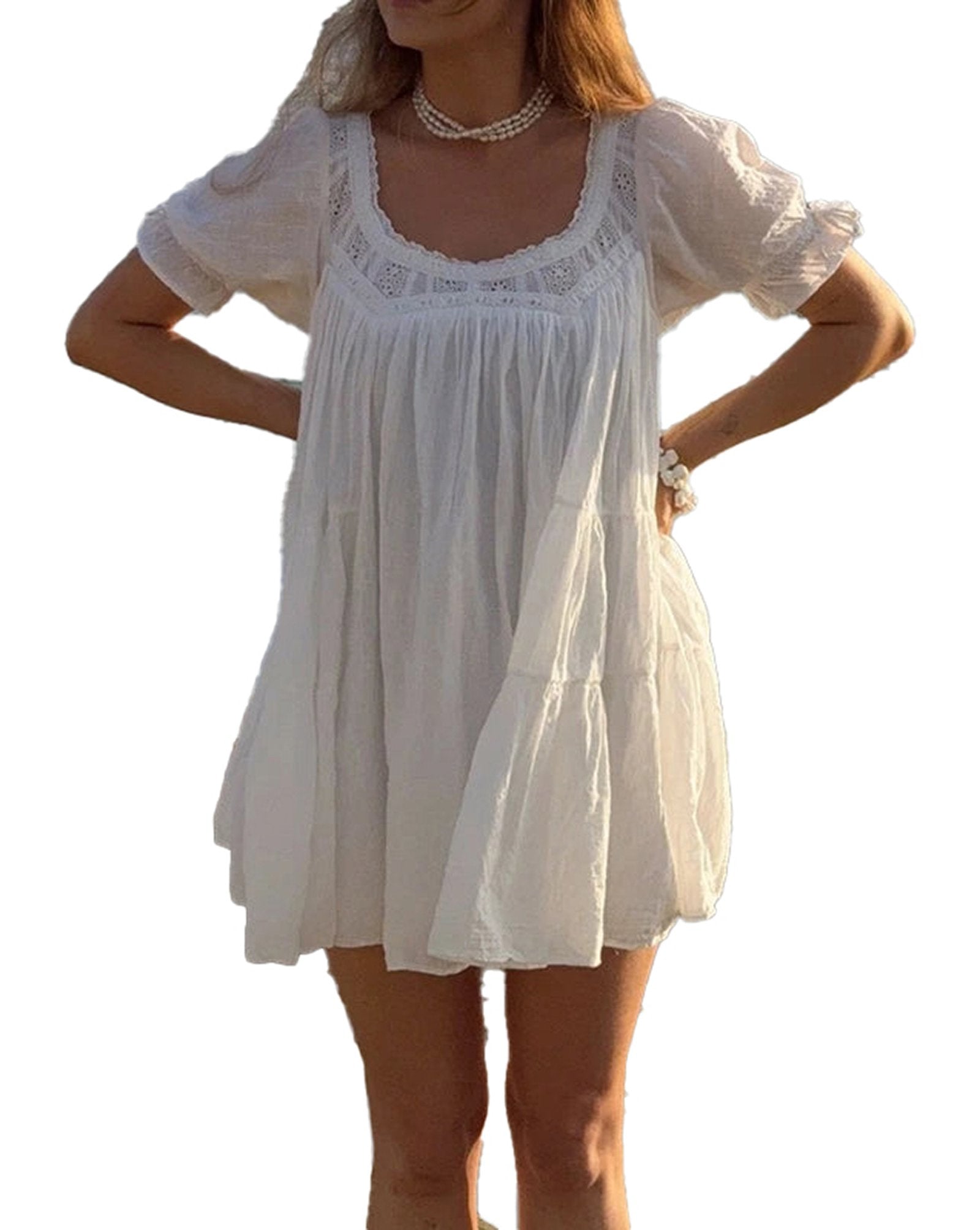 Vintage puff sleeve babydoll dress in white with delicate lace details and a flowing silhouette