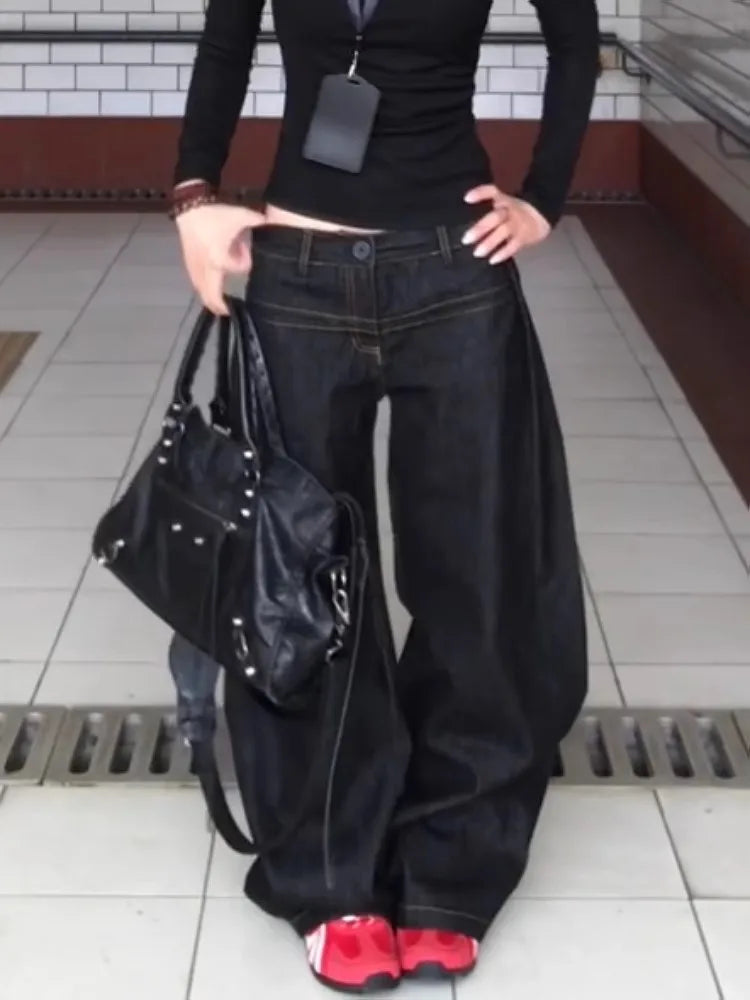 Women wearing vintage washed wide leg jeans women paired with a stylish black bag and red shoes