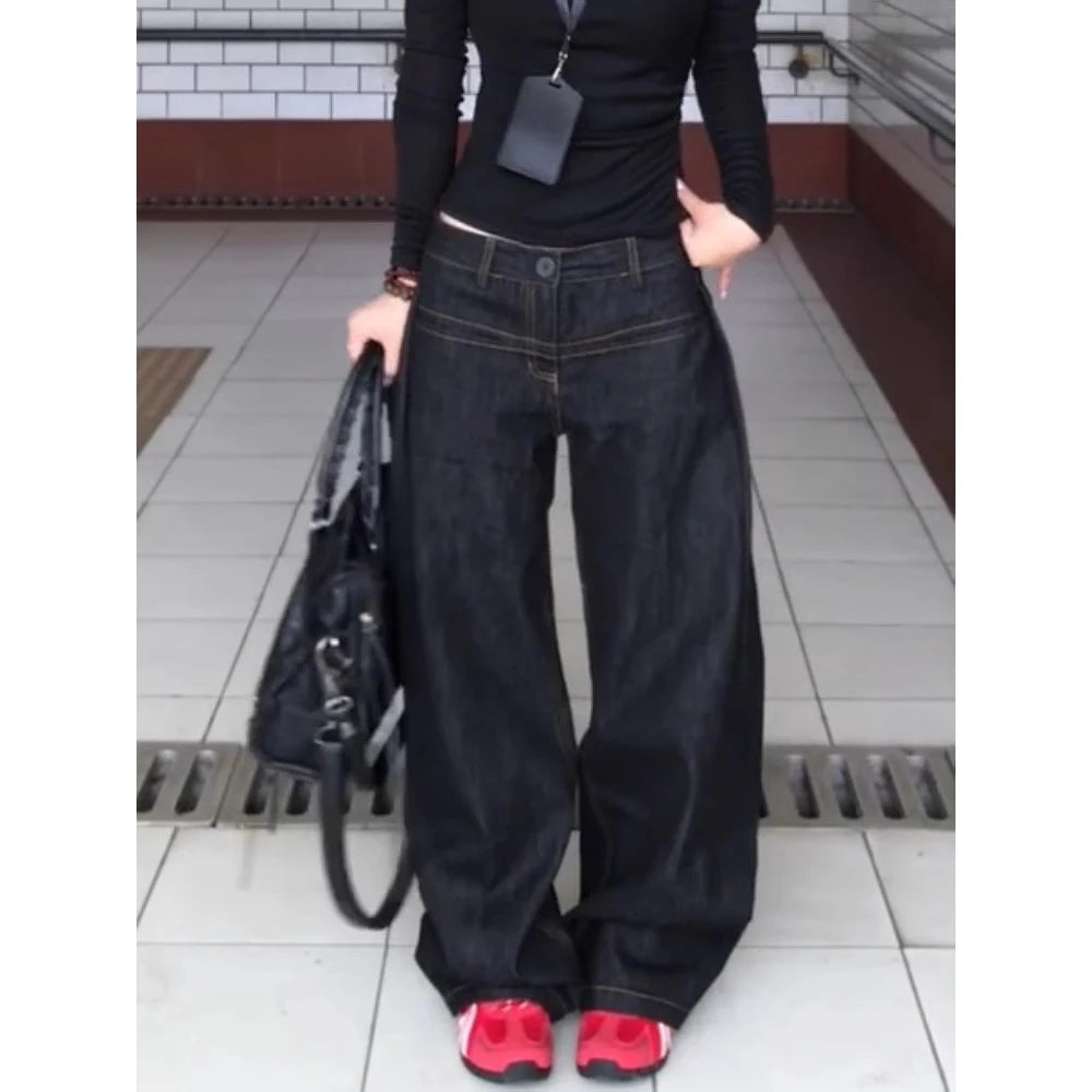 LuckeLadybug LLC vintage washed wide leg jeans women paired with a black top and stylish sneakers