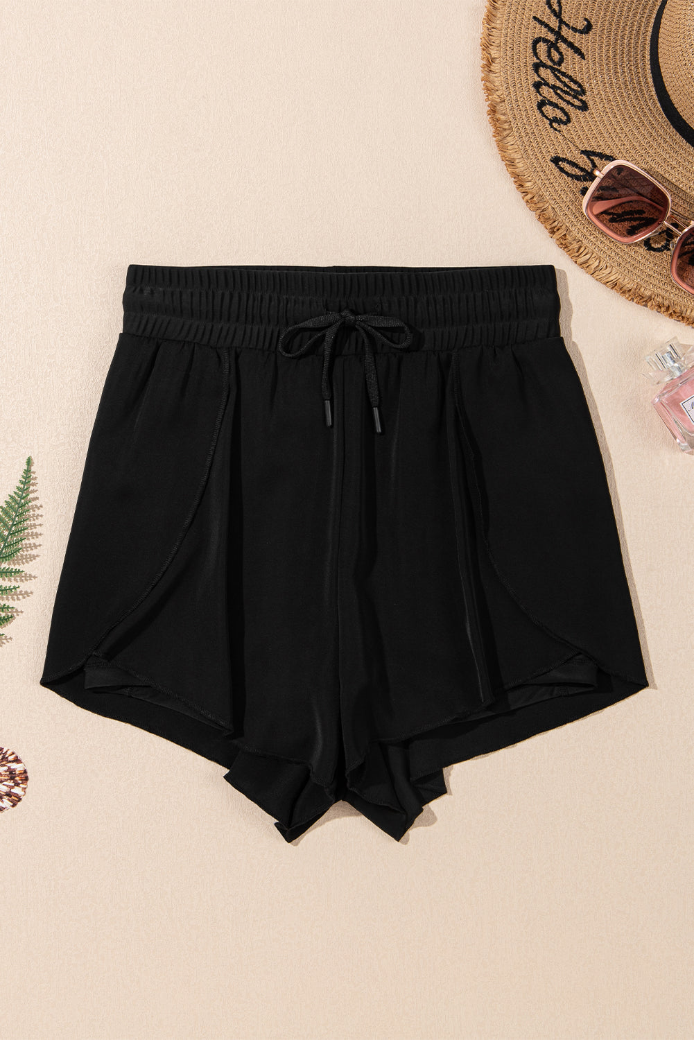 Black LuckeLadybug LLC boardshorts with a drawstring waist, perfect for beach days and summer fun, waisted jeans high
