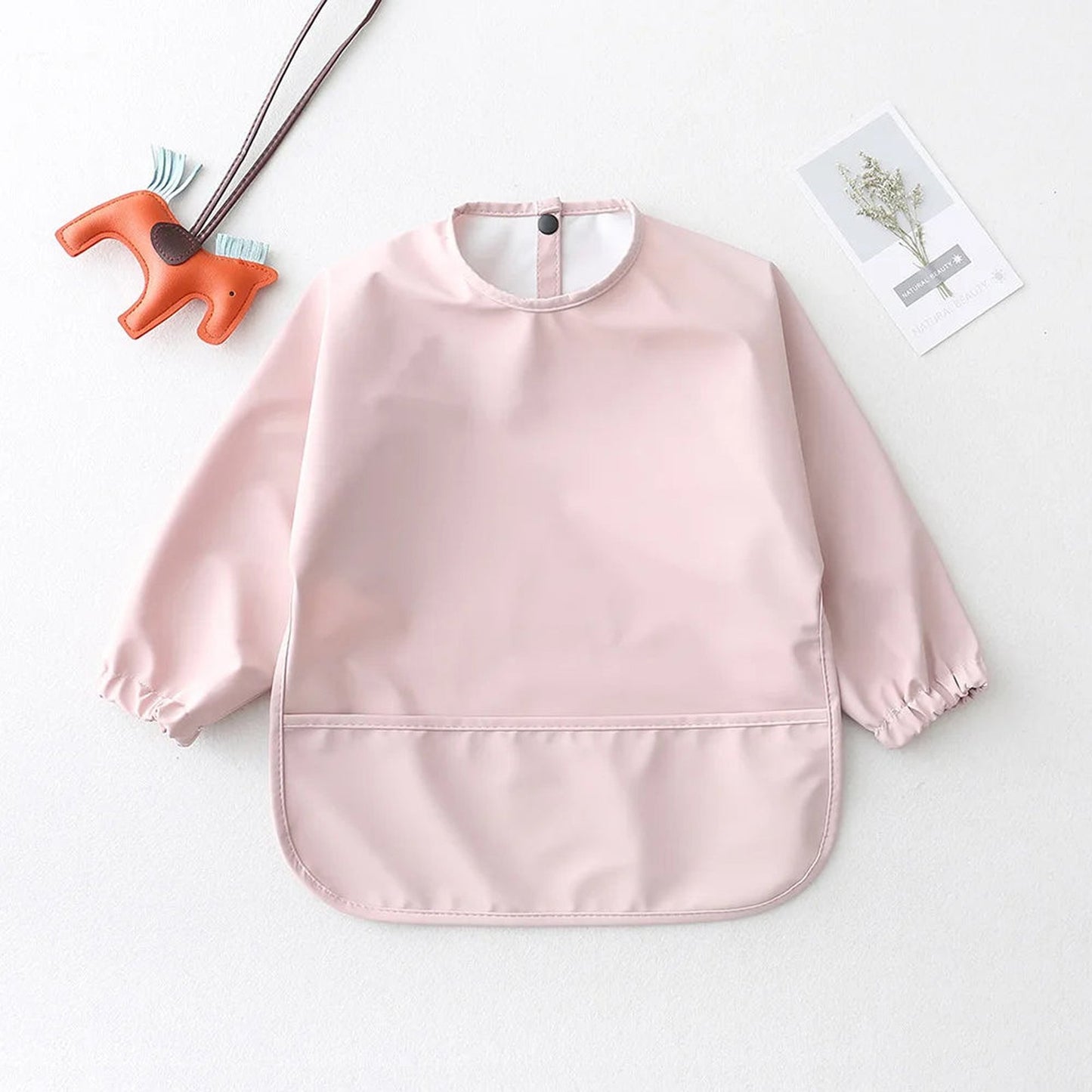 LuckeLadybug LLC Waterproof baby art smock in pink with elastic cuffs for mess-free creativity