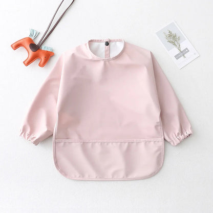 LuckeLadybug LLC Waterproof baby art smock in pink with elastic cuffs for mess-free creativity