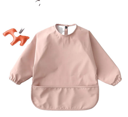 LuckeLadybug waterproof baby art smock in soft pink with elastic sleeves and front pocket for mess-free creativity