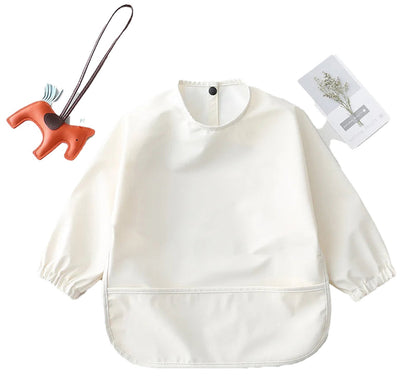 Cream waterproof baby art smock with elastic cuffs and front pocket for mess-free crafting