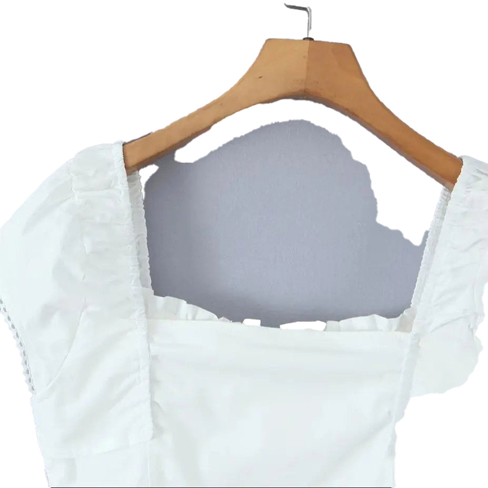 Elegant white corset crop top with ruffled sleeves and square neckline for stylish summer outfits