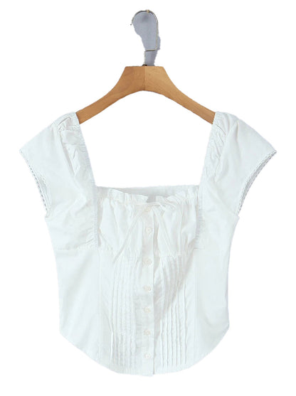 Stylish white corset crop top with button closure and flattering fit for trendy outfits