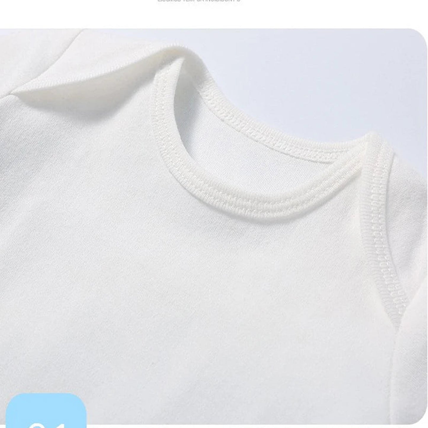 Close-up of a white cotton baby bodysuit featuring soft, comfortable fabric for infants