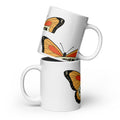 White glossy mug with butterfly design featuring orange and black butterfly wings by LuckeLadybug