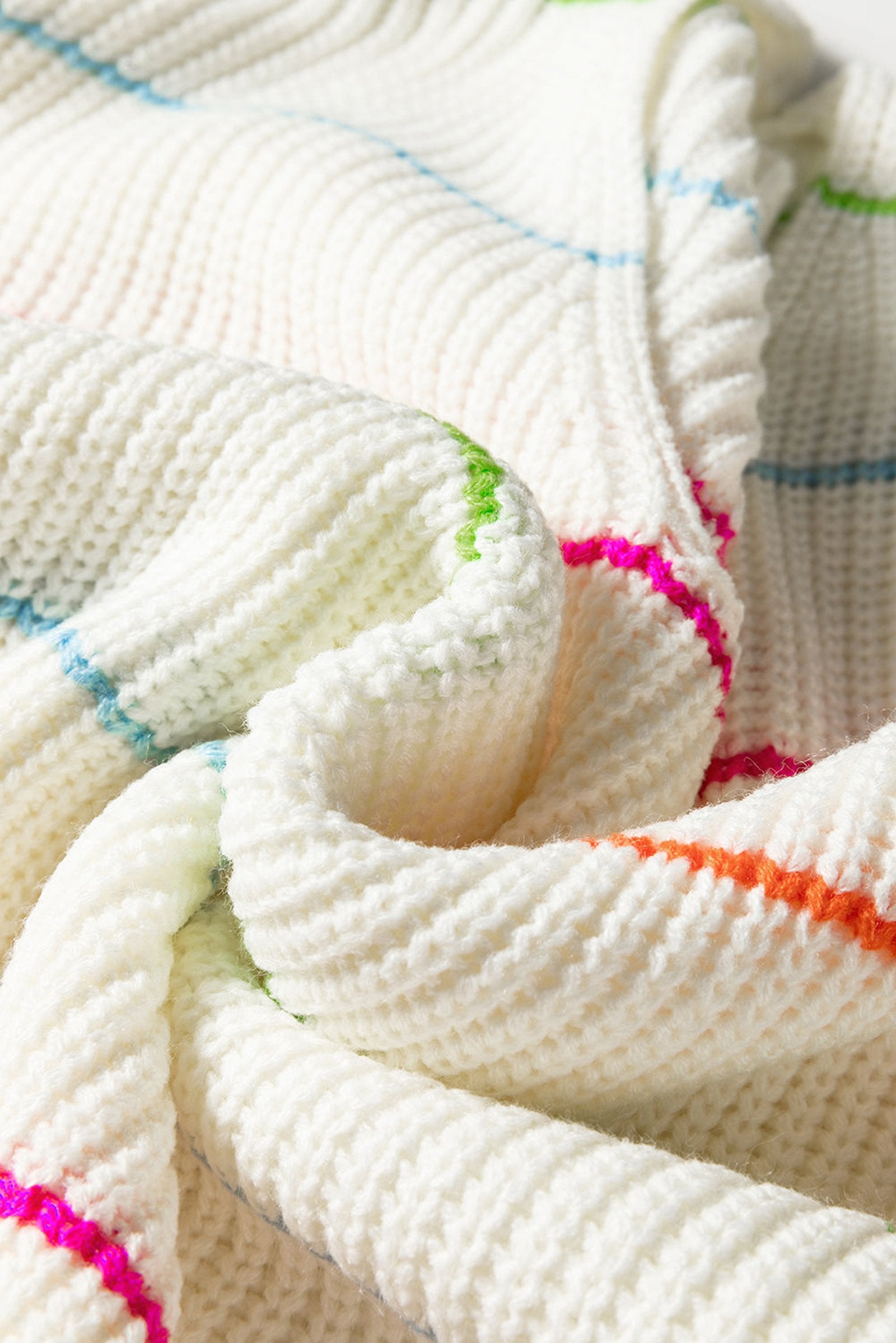 Cozy white v neck striped sweater with colorful horizontal stripes for a relaxed look
